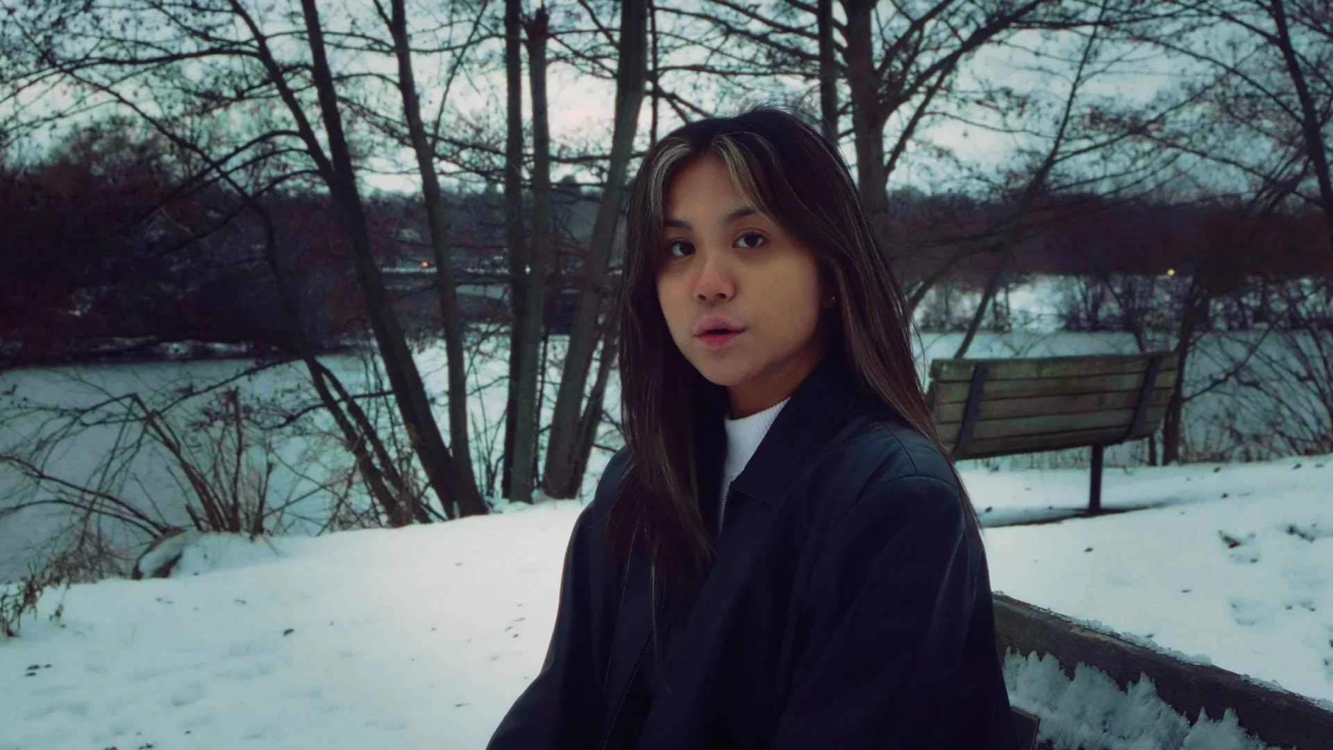 Lizette looking directly into the camera outdoors